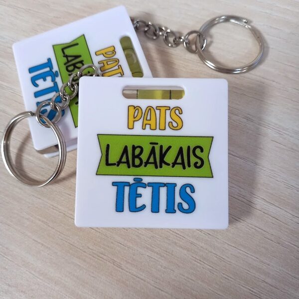 Atslēgu piekariņš/mērlena ar līmeņrādi